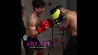 Gut punching in boxing match - scene from ABS ART muscle action film