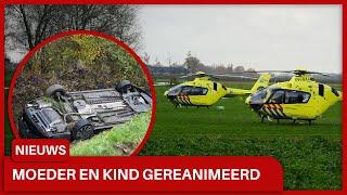 Vrouw met twee kinderen met auto in sloot in Uitwijk: Twee personen gereanimeerd