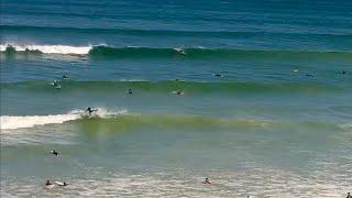 Surfer lands air 360 in front of live webcam at Muizenberg beach. Fun conditions  over the weekend