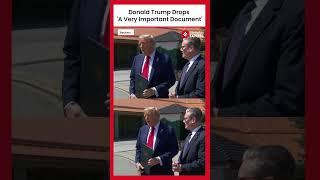 Moment When Donald Trump Dropped US-UK Trade Deal Papers