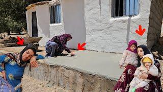 Khadija finished the cement of the cottage's porch and is thinking about the cottage's carpet.