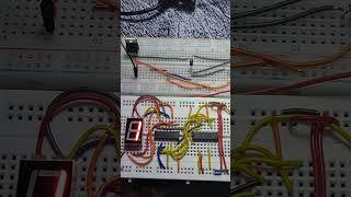 BCD-to-seven-segment decoder using 7447 IC , 7493 IC and 555 Timer IC