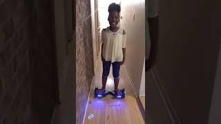 Baby girl dancing on the hoverboard 