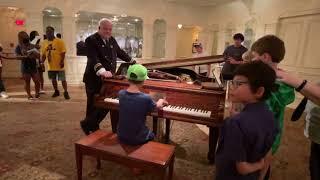 10 Year old plays piano for tourist at the Titanic Museum  @LoganRichPiano