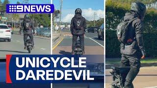 Electric unicycle rider weaves through busy Sydney traffic | 9 News Australia