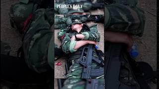 PLA  soldiers are still holding their guns tightly in the sleep