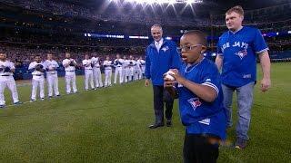 TB@TOR: Manfred presents first pitch to young fan