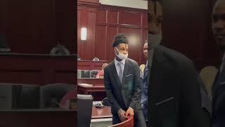 Jacksonville rapper Kshordy waves to family Friday after Duval jury finds him guilty in gun case.