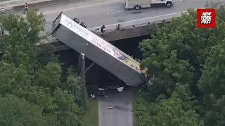 Semi-truck dangles off Pennsylvania overpass in shocking crash