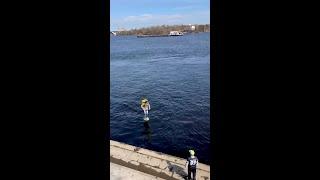 A Glovo Convenience Order Delivered by a Hydrofoil Surf Board Rider in Kyiv, Ukraine