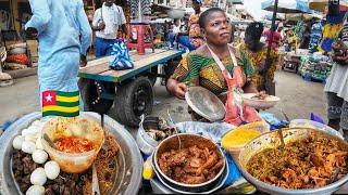 Delicious African street food in the biggest market in Togo west Africa. Assigame food vlog.