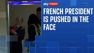 President Macron's wife appears to push him in the face