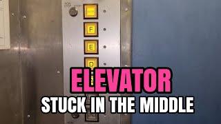 ELEVATOR DOOR STUCK IN THE MIDDLE, 3,000 USD FINE IF NOT FIXED.