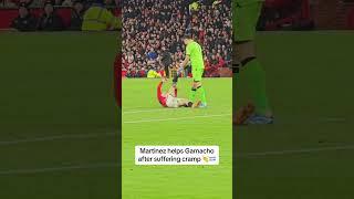 Emi Martinez helps Garnacho after suffering cramp during clash between Man Utd & Villa ️