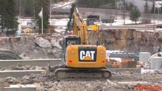 CAT 312E Excavator Swinging Rocks