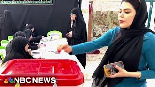 Iranians voting in a run-off presidential election