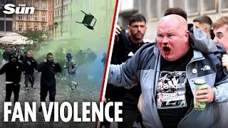 Moment Chelsea & Real Betis fans CLASH in Poland launching chairs & smoke grenades