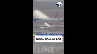 Near-miss between 2 planes at LAX caught on video