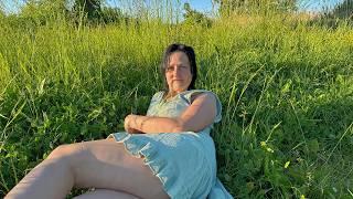 My wife tends the garden in a short dress. Evening work in the village