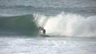 Daniel Thomson of Tomo Surfboards doing a crazy reverse at Rocky Point Hawaii.