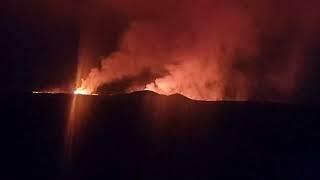 Lava still moving westwards. Two craters visible now.