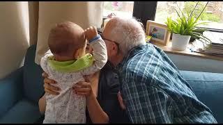 kiss ,no ! don't kiss my mom .Baby say to grandpa.