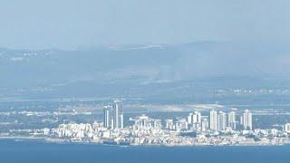 Smoke rises in northern Israel after dozens of rockets fired by Hezbollah | AFP