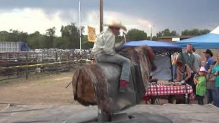 Young Bull Rider JC Mortensen on mechanical bull at Prescott rodeo