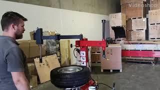 Demonstrating Bright LC810 tyre changer machine with assist arm