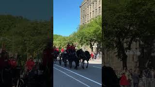 The King and Queen are on their way in the State Landau to open Parliament at the Senate in Ottawa.