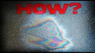 Why do oil puddles form rainbows?