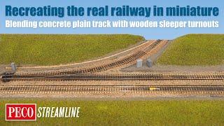 The realistic railway: blending concrete plain track with wooden sleeper turnouts.