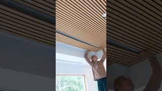 Installing acoustic slat panels on a ceiling. #slatwall #interiordesign #diy