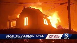 Homes burned, thousands evacuated as wildfires burn out of control in Los Angeles area