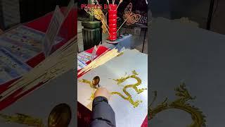 Chinese folk art inheritor prepares a sweet golden dragon treat
