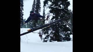 Snowboarding with Divide Board Shop snowboard log slide