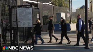 Voters wait in long lines in battleground states of Arizona and Nevada