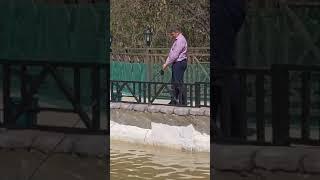 Дауир Шакиржан продолжает ловить рыбу на удочку в форелевом хозяйстве Олд стрит ранчно 13-ого Апреля