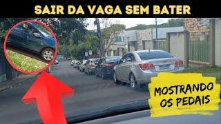 Sair com o carro estacionado na descida (mostrando os pedais)