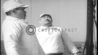 A Japanese submarine crew relaxes on the deck while underway in the Pacific Ocean...HD Stock Footage