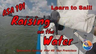 Raising the Main and the Jib on the Water