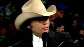 Dwight Yoakam giving platinum record to Ralph Emery