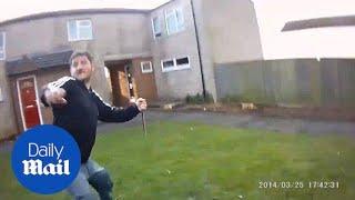 Body-cam footage shows knife wielding man running at police - Daily Mail