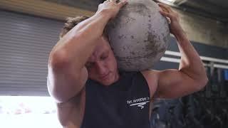 STRONG Man Lifts Heavy Concrete Ball (Stock Footage)