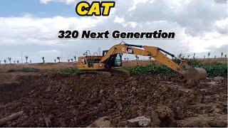 Digging soil to avoid flood water by excavator 320 Cat