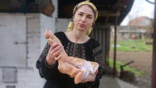 Woman is cooking traditional meat jelly in village oven. Natural Ukrainian Aspic (Kholodets)