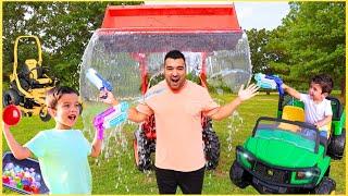 Dumping Tractor Water on Dad and Super Soaker Water Balloon Battle with Riding Mower | Super Krew