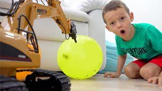 Sophia and Max are playing with a toy excavator tractor and balloons