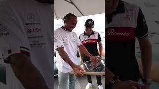 Valtteri gifts Lewis a signed print of his botASS photo