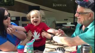 Mom & Gpa tickle V while camping